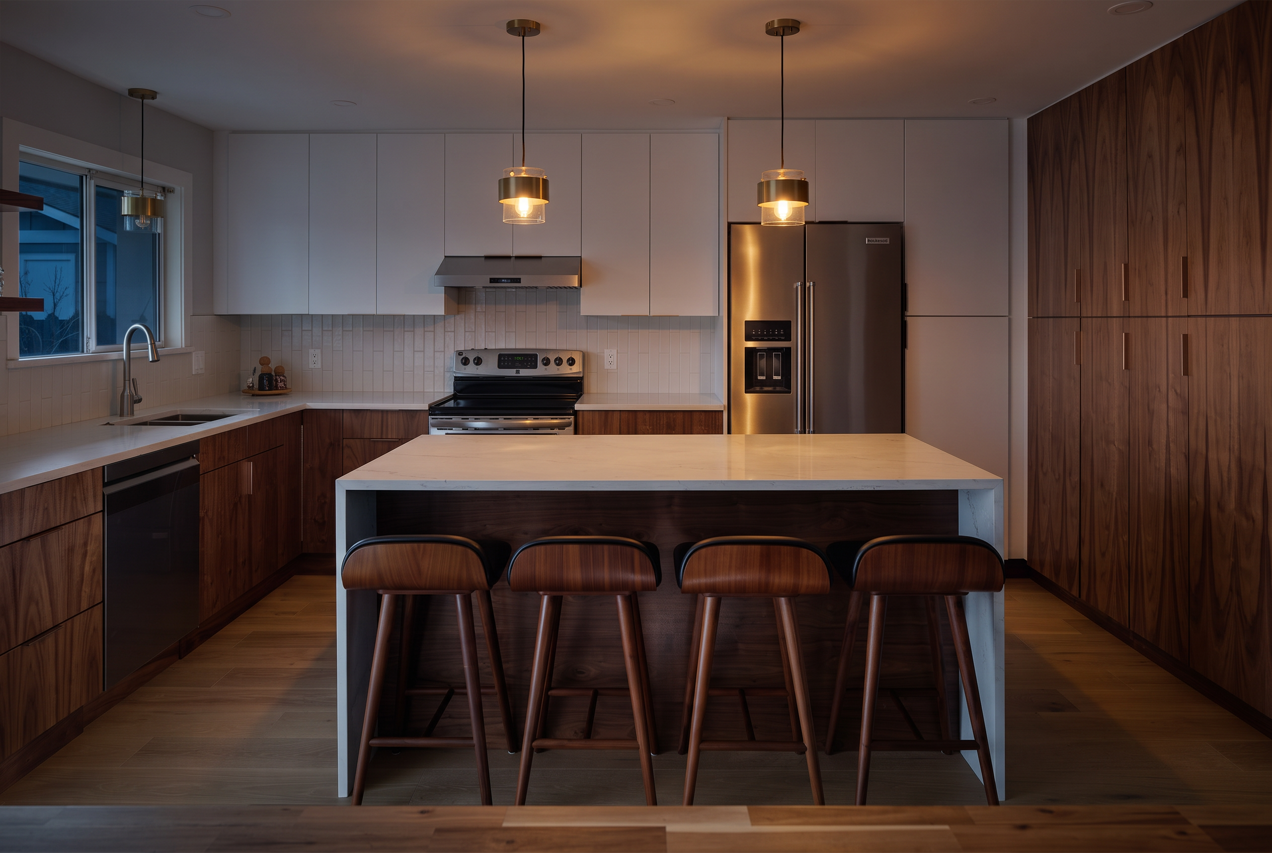 Walnut and white modern kitchen with waterfall island by Provincial Cabinets